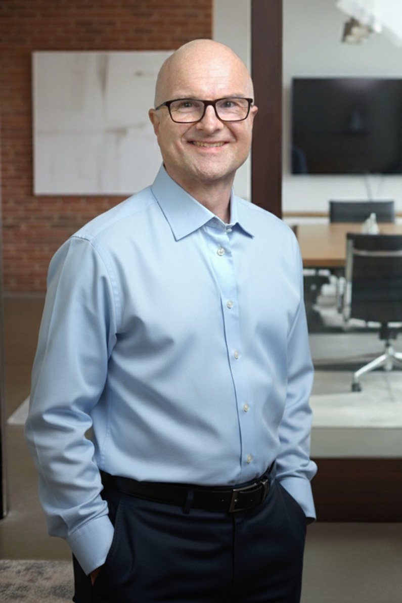 Dan Liutikas in a conference room